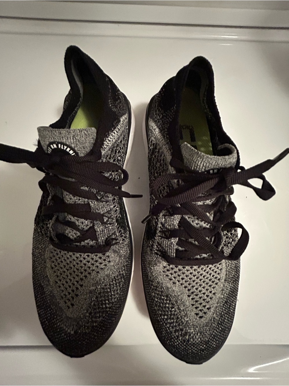 Women’s Nike Free RN Flyknit Black and Gray Knit Athletic Sneakers